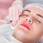 injection-syringe-in-the-womans-face-P48D4PW.jpg